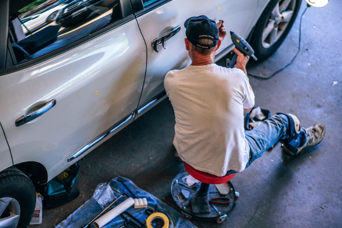 a mechanic working on a car